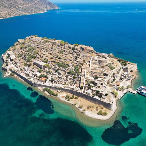 An aerial view of the fortress on the island of Spinalonga with calm sea