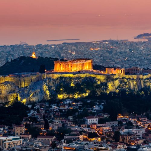 Scenic panoramic view on Acropolis in Athens, Greece at sunrise. Colourful travel background with dramatic sky